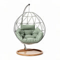 Chaise suspendue en métal avec coussin vert en tissu dimensions 80 x 80 x 120cm